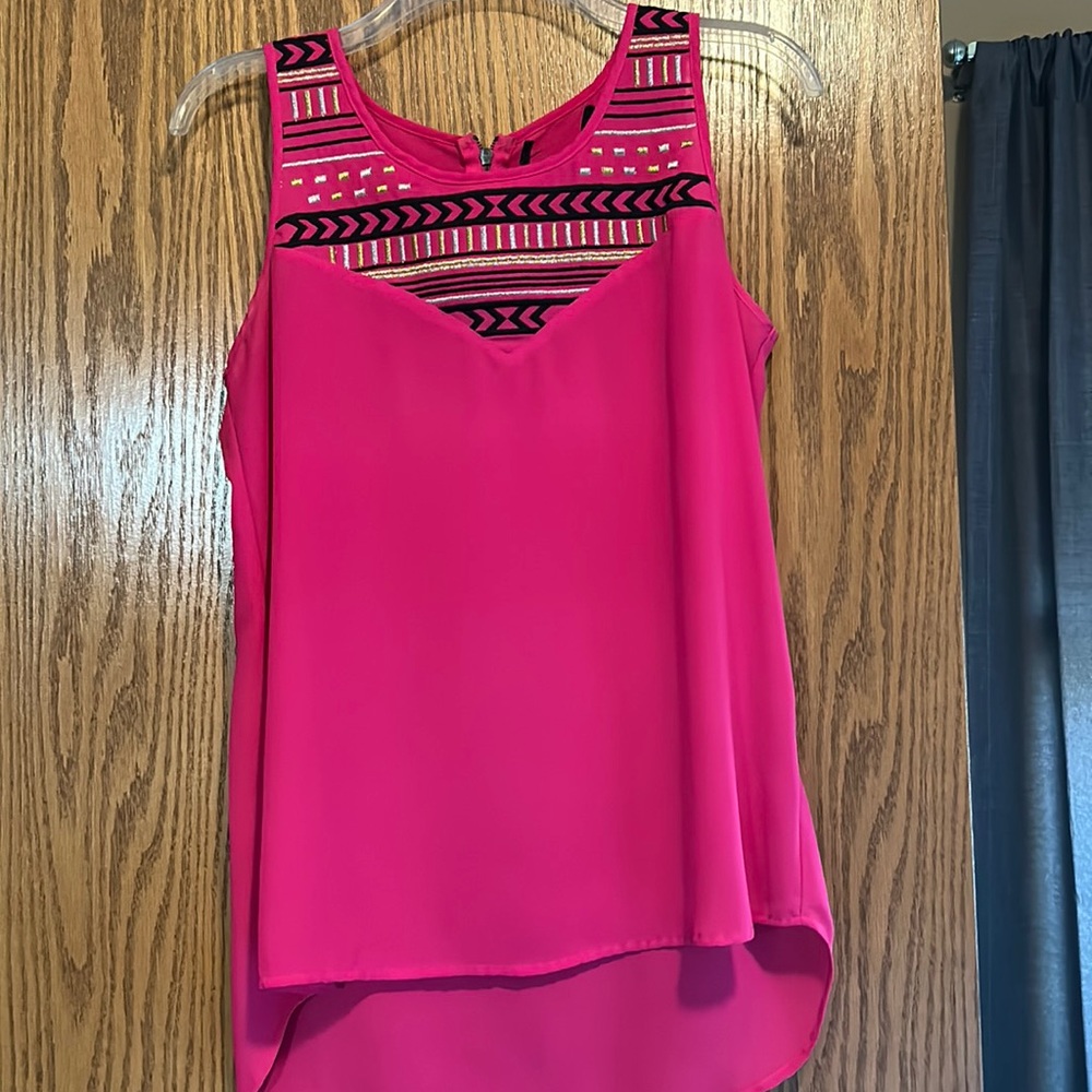 Fuchsia short sleeve top.  Tribal elements. Metallic stitching